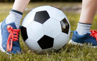 Mitigating Concussions - child playing soccer