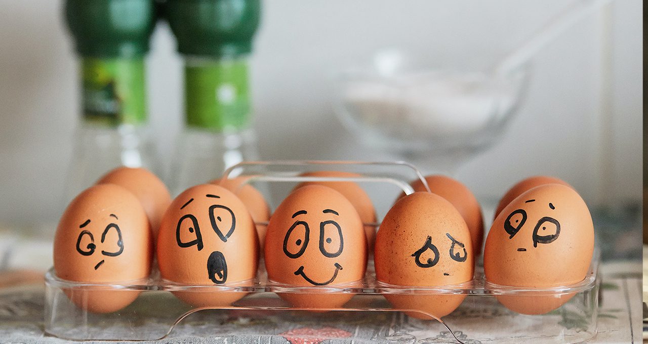 hard boiled eggs with faces drawn on them