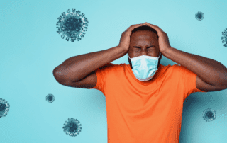 man wearing mask frustrated with germs